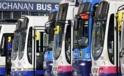 multiple buses all parked in a row to represent the large 8,000 bus stop maintenance contract.