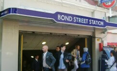 view of the entrance to bond street station with the TfL signage in view.