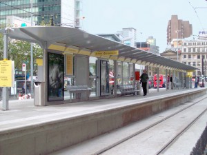 train station canopy with metrolink scrolling displays underneath.