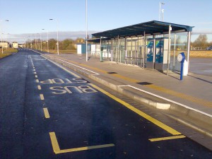view of Cambridge bus shelter with a canopy and ticket machine.