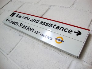 view of directional slat signs installed providing wayfinding.