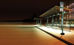 view of an installed elite bus shelter at night.