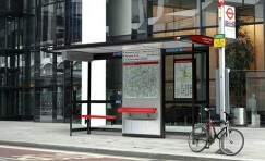 view of installed Landmark London bus shelter with public seating.