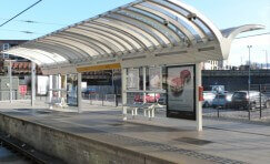 view of Manchester Victoria platform's waiting shelter from the other side of the platform.