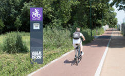 cyclist going past a digital cycle counter.