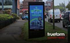 Digital advertising unit in Surrey featuring Trueform’s sustainable D6 freestanding display with green sedum roof.