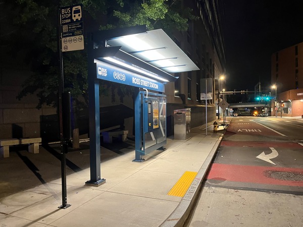 Trueform’s modern glass Bus Rapid Transit (BRT) shelter in downtown Pittsburgh, as featured on CBS News, showcasing sustainable design and smart technology.