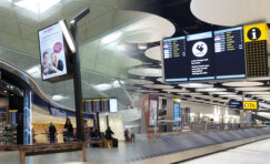 Airport passenger experience enhanced through modern wayfinding, transport infrastructure and passenger facilities outside a terminal building.