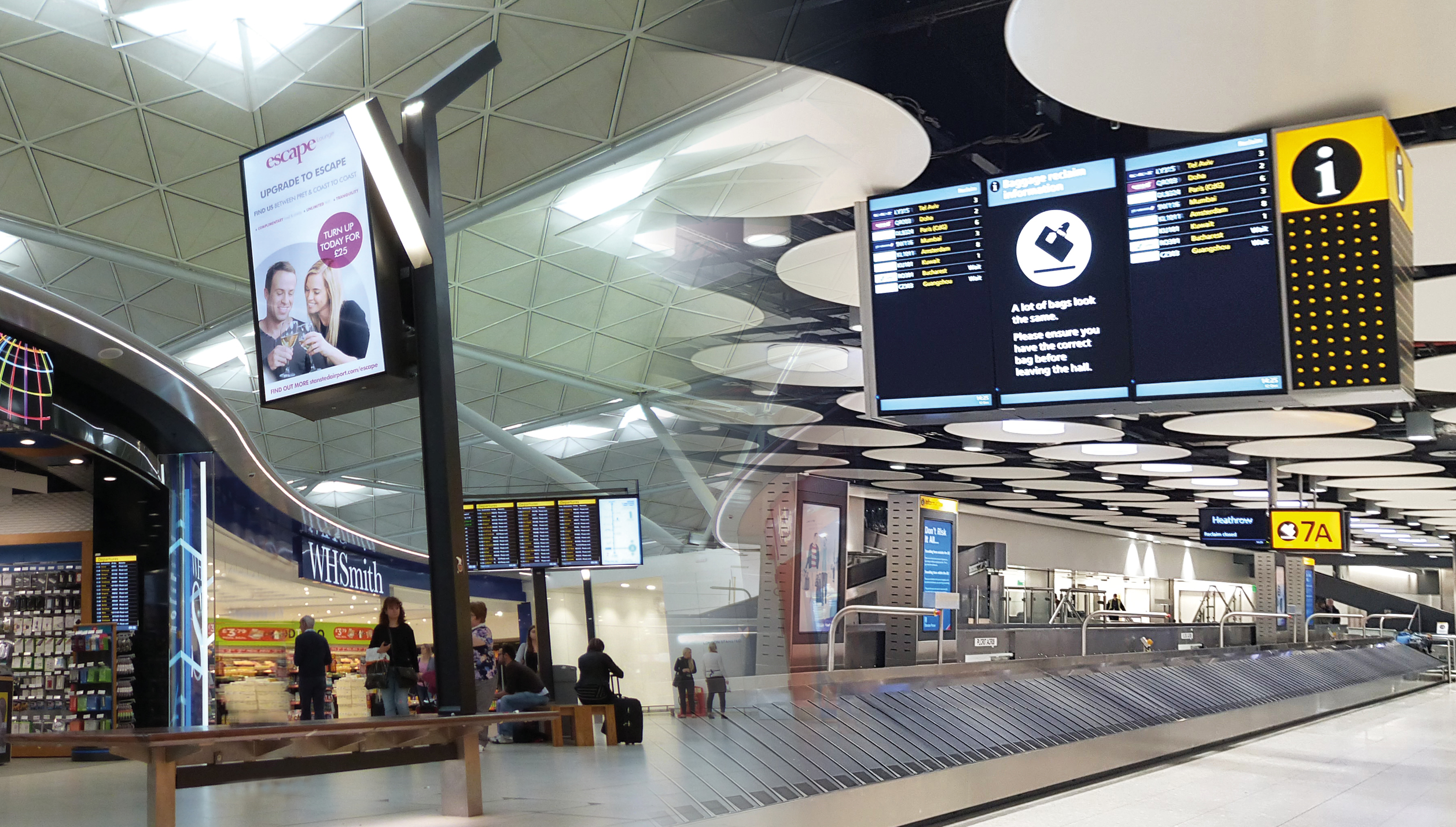 Airport passenger experience enhanced through modern wayfinding, transport infrastructure and passenger facilities outside a terminal building.